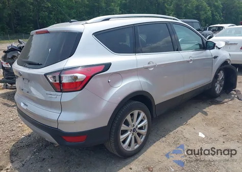 2017 Ford Escape Titanium z USA, uszkodzony, nr VIN 1FMCU0JD8HUE87385